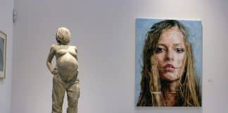 naked pregnant woman statue and woman's portrait